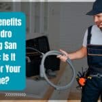 ​Hydrojetting San Diego: Professional plumber performing hydro jetting on a residential drain in San Diego.