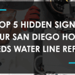 Close-up of a plumber inspecting underground water pipes for water line repair San Diego