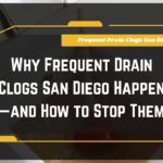 Frequent Drain Clogs San Diego: Close-up of a plumber unclogging a kitchen drain pipe in San Diego.